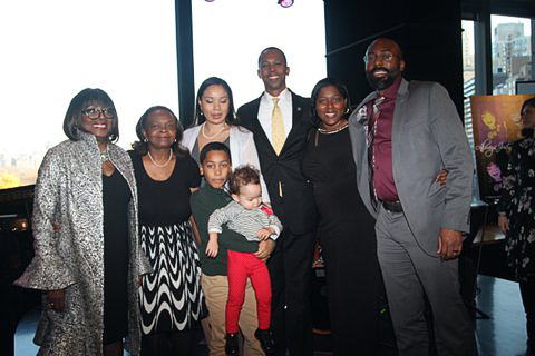 Audrey poses with proud family (l-r) Marilyn Mosley, Dr. Janice Carrero Mosley, Assemblyman Walter T. Mosley III, Sameita Jennings, Dr. James Jennings (front) Sebby Carrero Mosley, Ally Eh-Suk Mosley